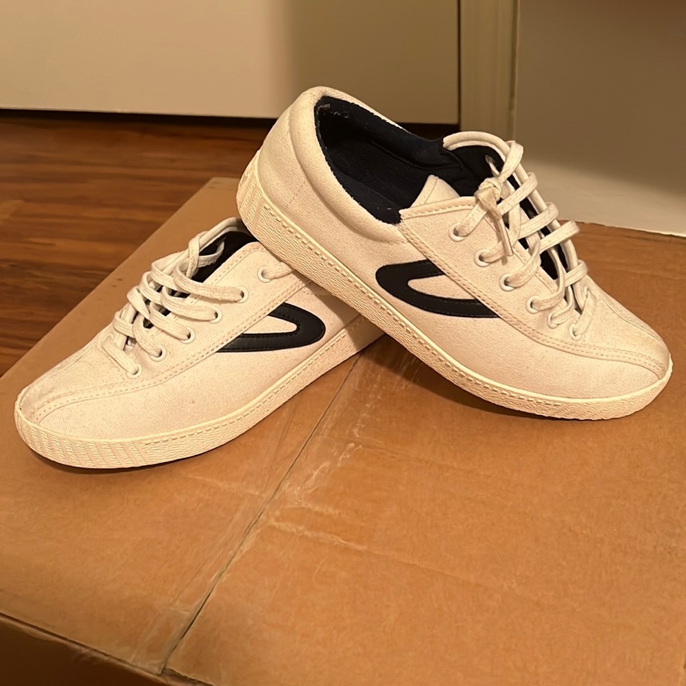 White and navy tretorns